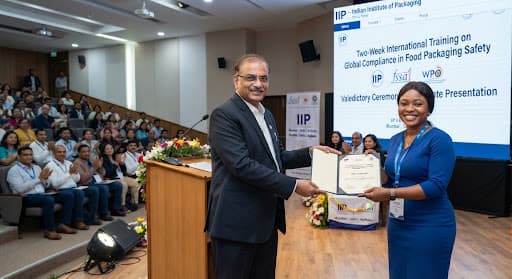 Director IIP presenting training programme certificates